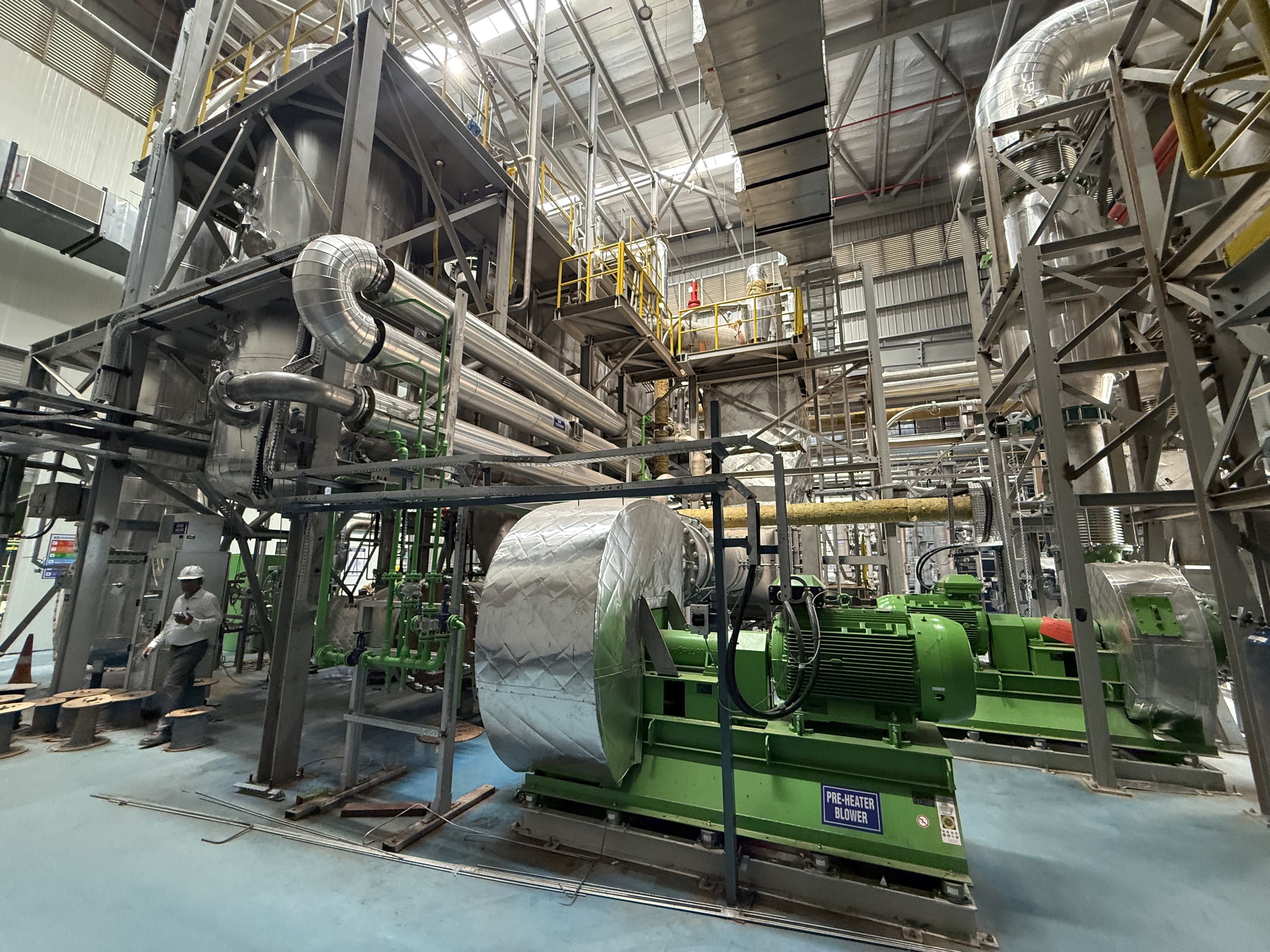 Process plant interior with blowers and insulated pipework